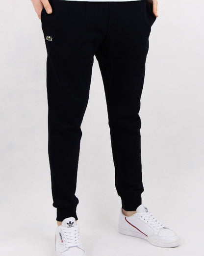 Lacoste – Schmale Fleece-Trainingshose mit Bündchen in Schwarz