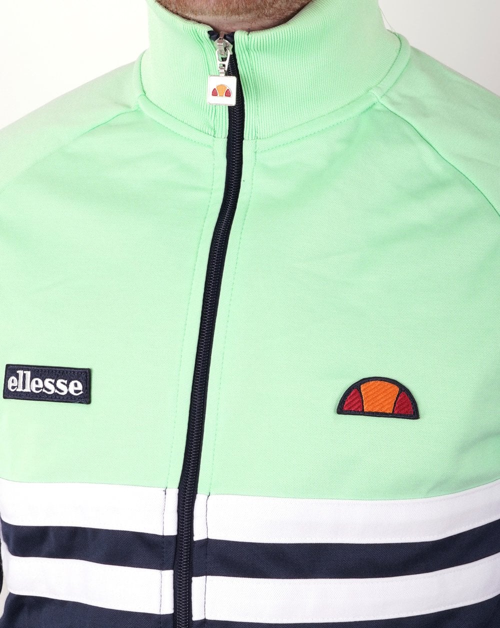 Ellesse – Rimini Trainingsjacke in Marineblau und Pastellgrün