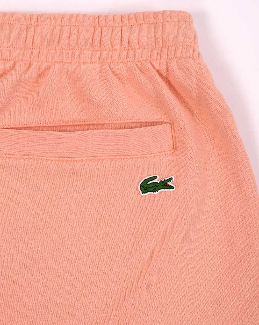 Lacoste – Bestickte Fleece-Shorts in Pfirsich
