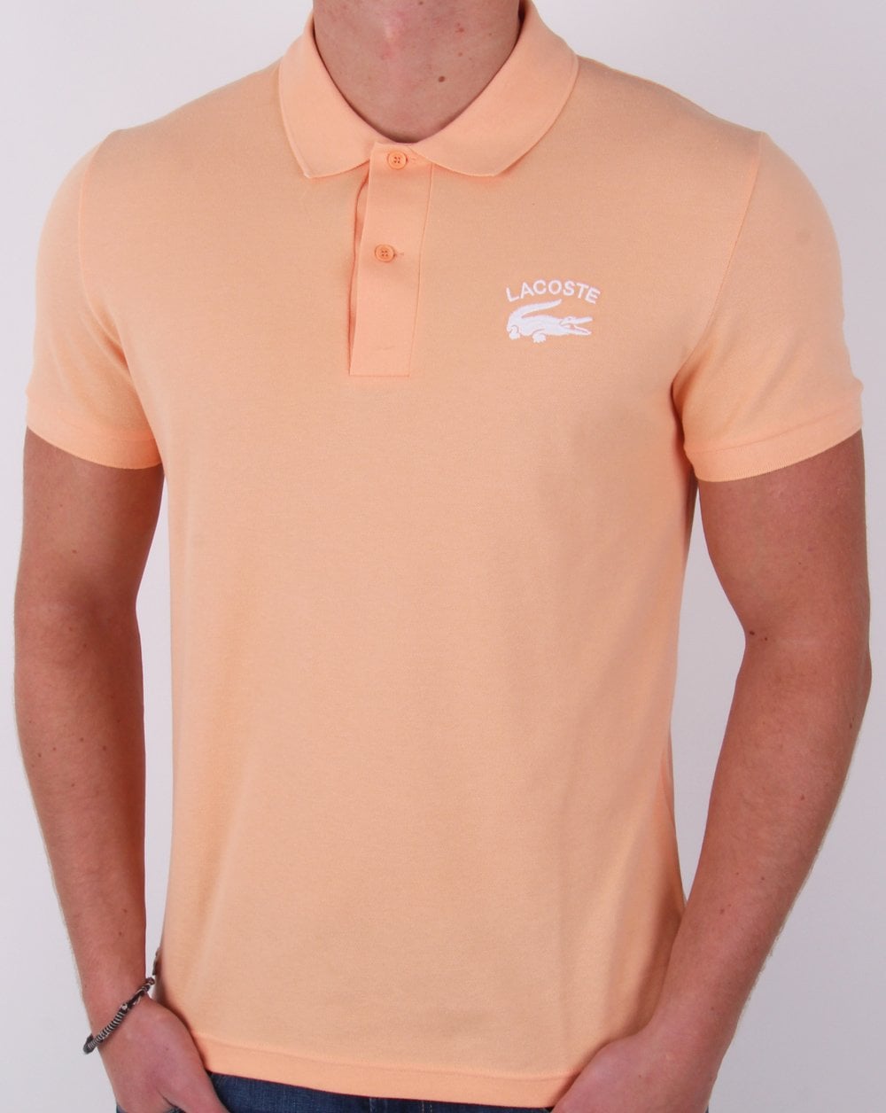 Lacoste – Poloshirt mit gesticktem Logo in Pfirsich