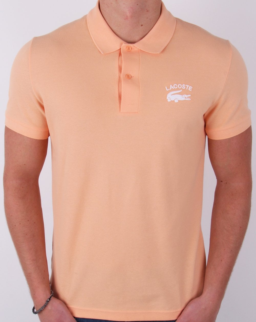 Lacoste – Poloshirt mit gesticktem Logo in Pfirsich