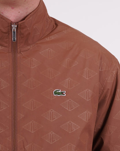 Lacoste – Trainingsjacke mit Monogramm-Print, Hellbraun