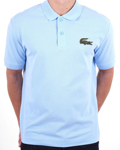 Lacoste – Poloshirt mit großem Krokodilmuster, Himmelblau