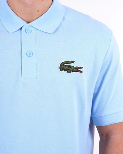 Lacoste – Poloshirt mit großem Krokodilmuster, Himmelblau