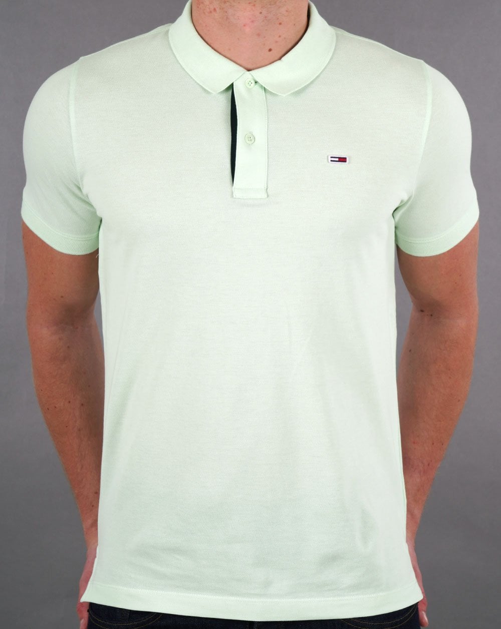 Tommy Jeans – Poloshirt mit Signatur-Knopfleiste, Minzgrün