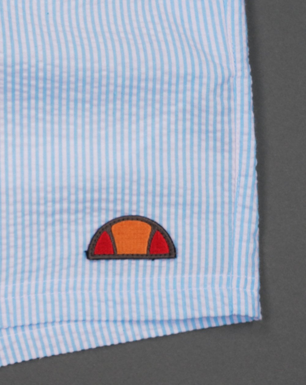 Ellesse – Carali – Gestreifte Badeshorts, Himmelblau