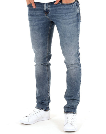 Tommy Jeans – Scanton – Schmal geschnittene Jeans in mittlerer Waschung