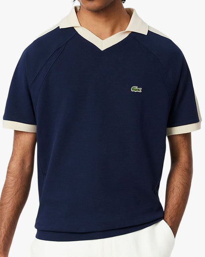 Lacoste – Poloshirt mit Piqué-Einsatz in Marineblau