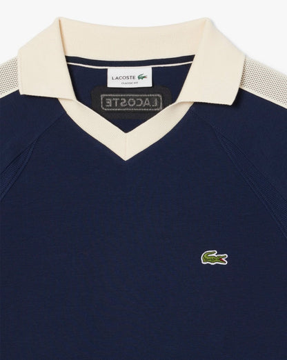 Lacoste – Poloshirt mit Piqué-Einsatz in Marineblau
