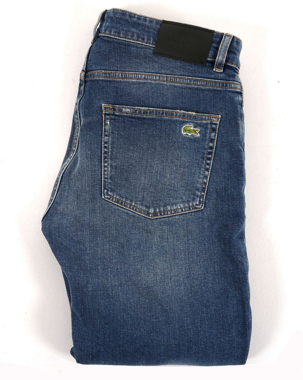 Lacoste – Slim Fit – Indigoblaue Jeans in verwaschenem Dunkelblau (Medium Washed)