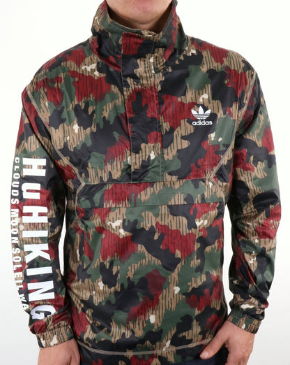 Adidas Originals – Pharrell Williams HU – Wander-Windjacke mit halbem Reißverschluss und Camouflage-Muster