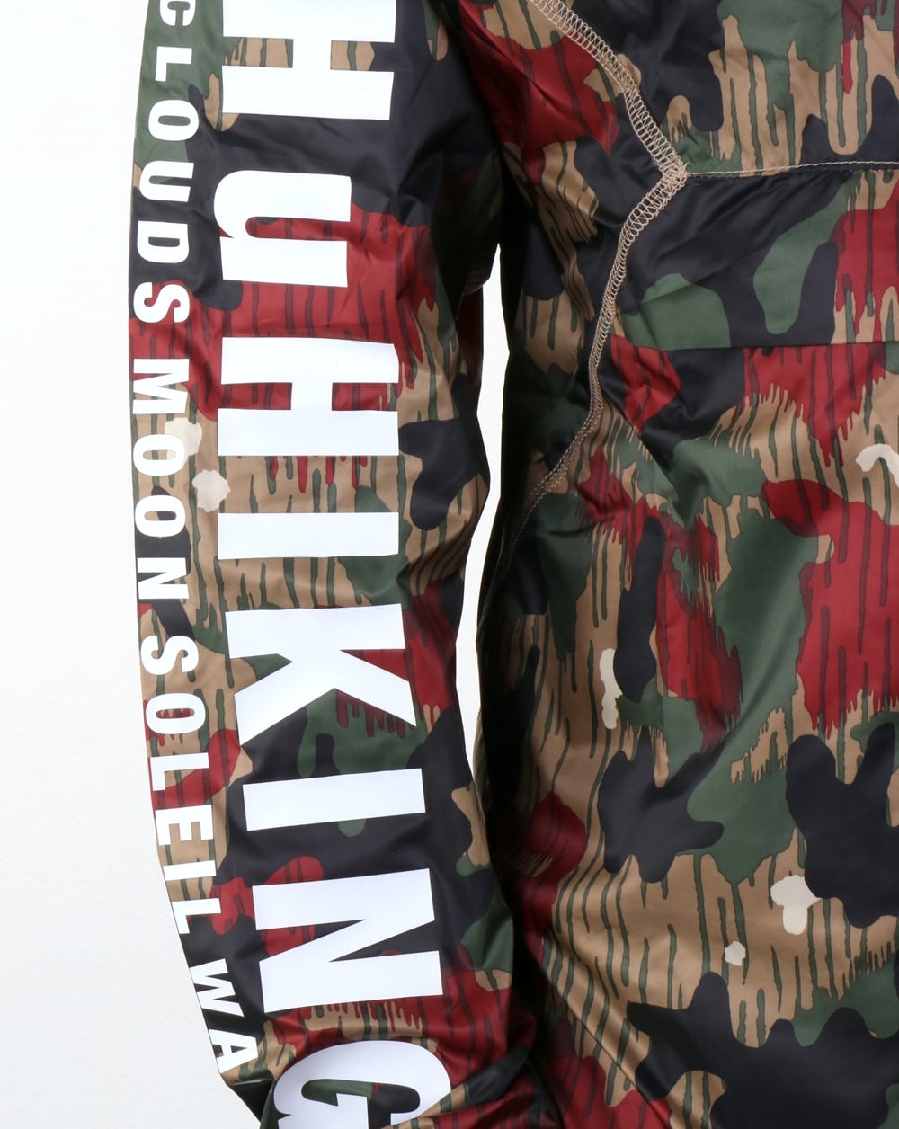 Adidas Originals – Pharrell Williams HU – Wander-Windjacke mit halbem Reißverschluss und Camouflage-Muster