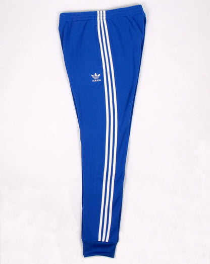 Adidas Originals – Superstar – Trainingshose mit Bündchen in Blau