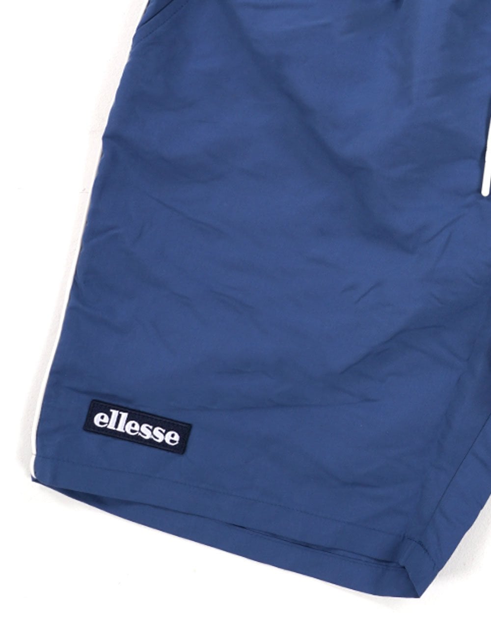 Ellesse – Lange Badeshorts in Marineblau