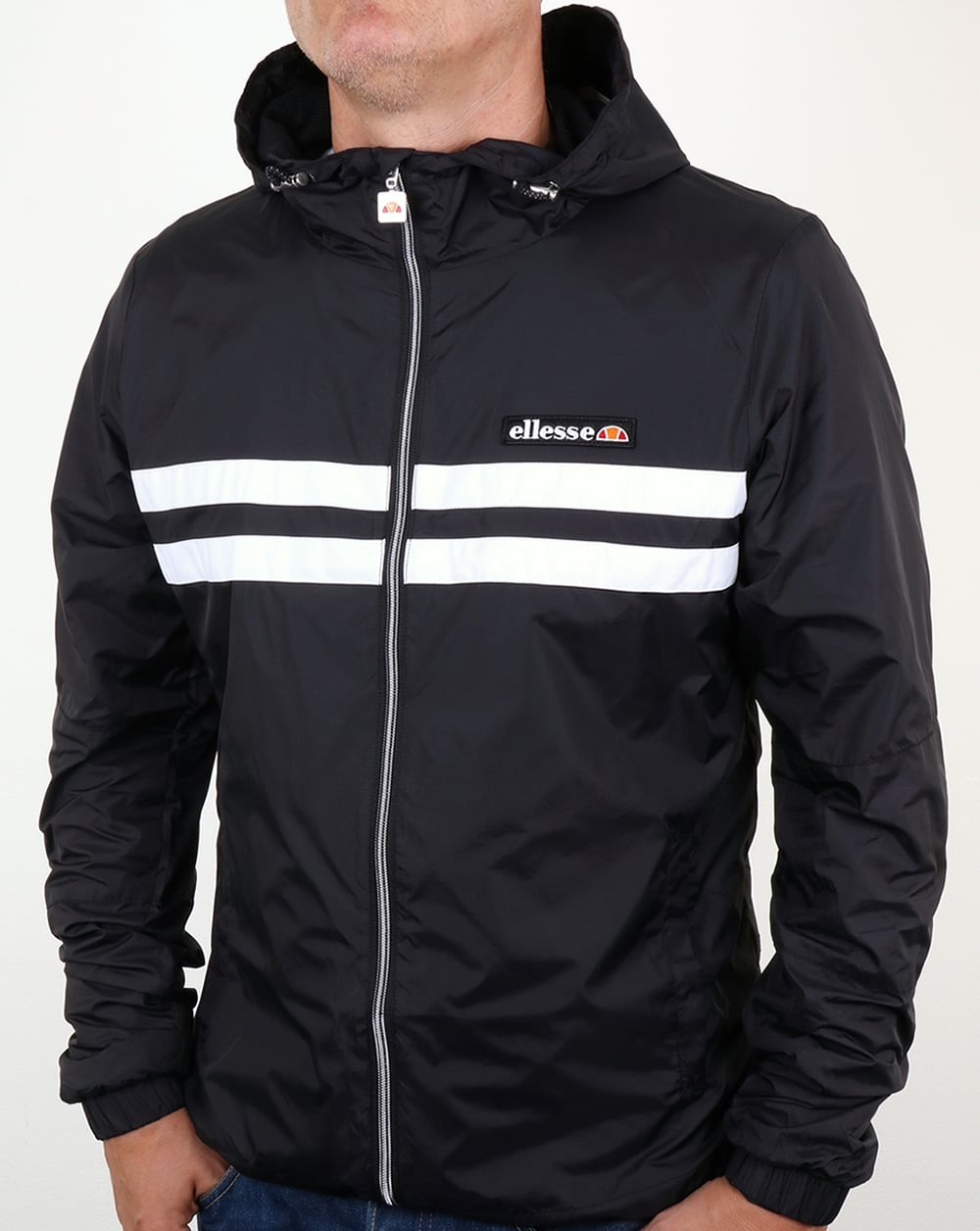 Ellesse – Rimini – Gestreifte Regenjacke in Schwarz