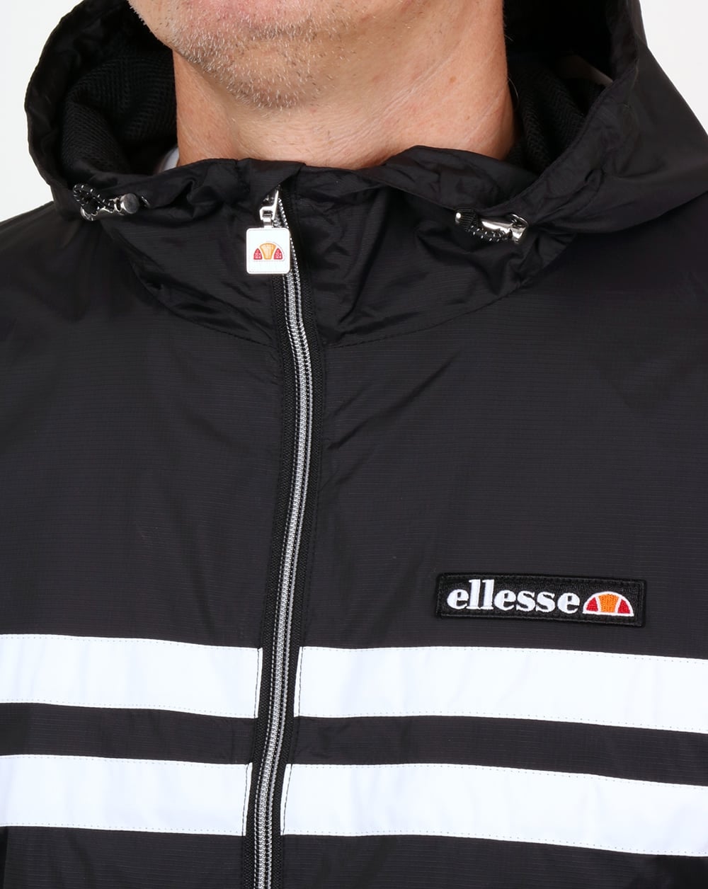 Ellesse – Rimini – Gestreifte Regenjacke in Schwarz