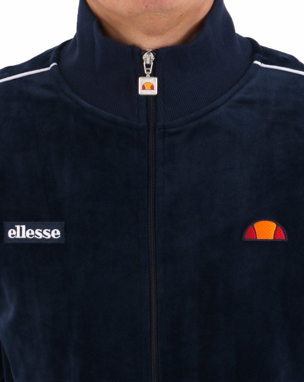 Ellesse – Trainingsoberteil aus Velours mit Paspelierung in Marineblau