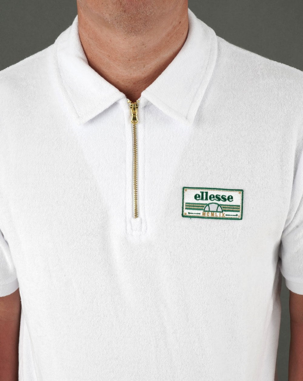 Ellesse – Frottee-Poloshirt mit Reißverschluss in Weiß