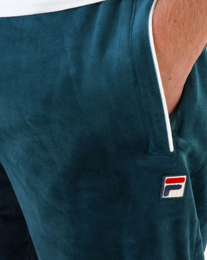 Fila – Vintage-Trainingshose aus Velours in Dunkelblaugrün